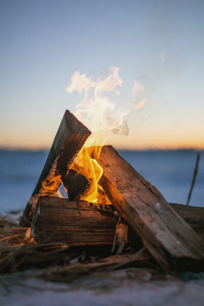 Sacred fire on beach at sunset